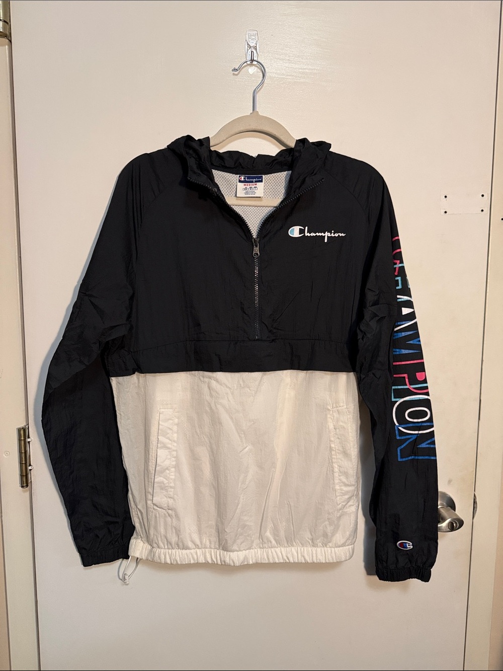 Champion Black & White Hooded Pullover Rain Jacket with Colorful Sleeve Logo